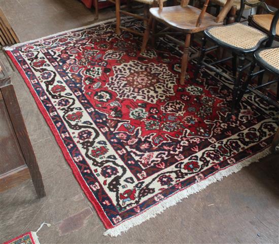 Persian red ground rug(-)